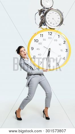 Young Woman Cant Organize Her Worktime. Forced To Constantly Stay And Work Longer. Holding The Big C