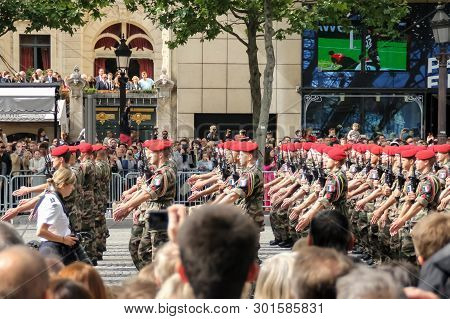 France, Paris - July 14, 2014: Participants And Spectators At The Parade In Honor Of The Bastille Da