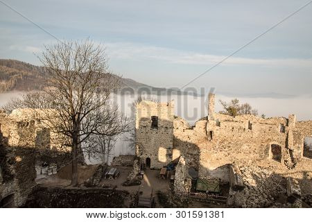 Ruins Of Povazsky Hrad Castle Above Povazska Bystrica City In Slovakia With Tree Snd Hill On The Bac