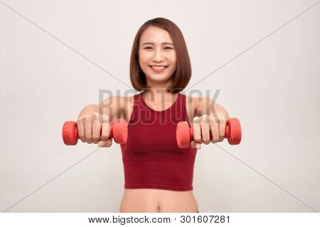 Woman Is Exercising With Dumbbells. Image. Conccept