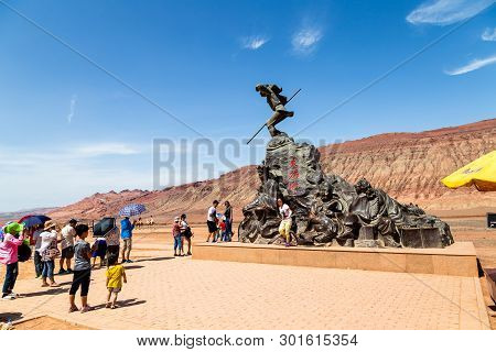 Aug 2017, Flaming Mountains, Xinjiang, China: Tourists Near A Statue From A Scene Of The Chinese Epi