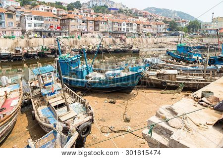 Aug 2015, Qingdao, China: Wooden Fishing Boats In The Village Of Shazikou, Qingdao, China