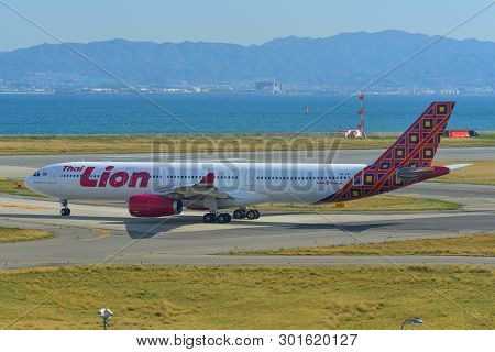 Passenger Airplane Taxiing On Runway