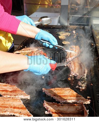 Many Pieces Of Meat Cooked On The Grill During A Country Festival