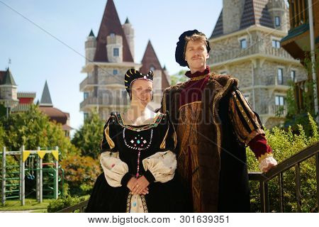 Couple, Duke And Duchess Against The Backdrop Of The Castle In A Beautiful Park