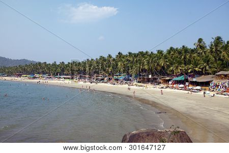 Goa, India - January 31, 2014:vacationers, Sellers, Cafe On The Tropical Beach Palolem