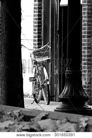 Autumn Bicycle On Kickstand Near Wall In Autumn