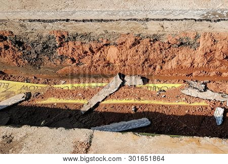 A Trench Showing A Cross Section Of A Road.