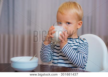 Baby Nutrition. Eat Healthy. Toddler Having Snack. Healthy Nutrition. Drink Milk. Child Hold Glass O