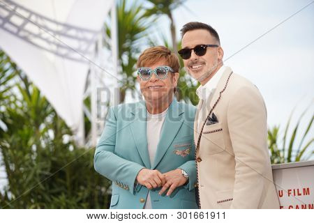 Elton John and David Furnish attend the photocall for 