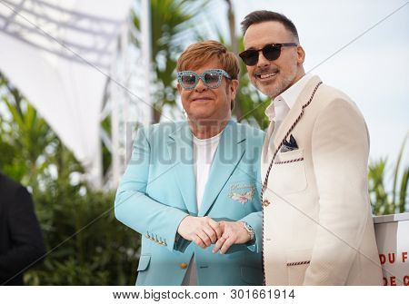  Elton John and David Furnish attend the photocall for 