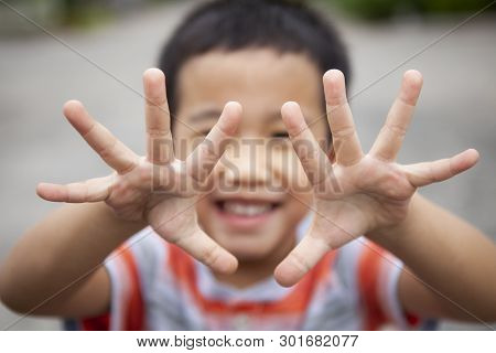 Children Smiling Face Show Ten Finger By Two Hand