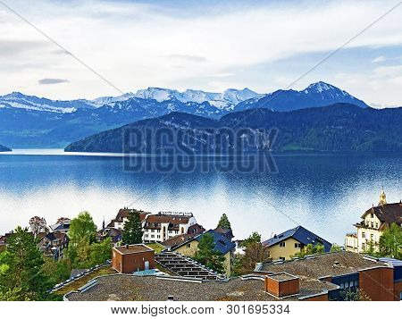 View Of Lake Lucerne Or Vierwaldstaetersee With Vitznau Settlement And Swiss Alps In The Background 