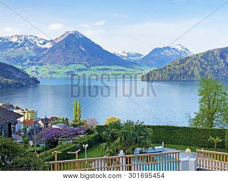 View Of Lake Lucerne Or Vierwaldstaetersee With Vitznau Settlement And Swiss Alps In The Background 