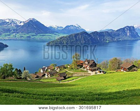 View Of Lake Lucerne Or Vierwaldstaetersee With Vitznau Settlement And Swiss Alps In The Background 