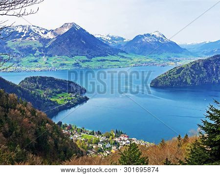 View Of Lake Lucerne Or Vierwaldstaetersee With Vitznau Settlement And Swiss Alps In The Background 