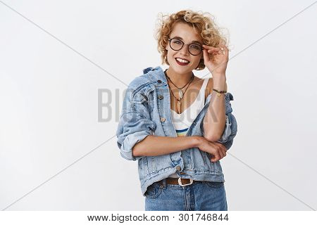 Portrait Of Happy Accomplished And Confident Good-looking Stylish Modern Girl In Denim Jacket Glasse