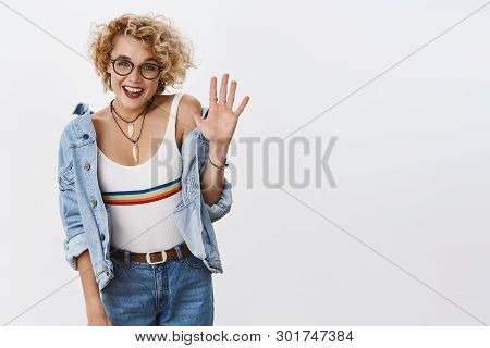 Five Stars To Your Product. Indoor Shot Of Enthusiastic Stylish Female Blonde With Glasses And Pierc