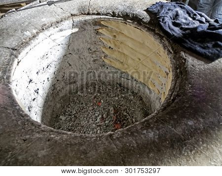 Baking Georgian Bread In A Round Oven, Just Pasted A Cakes Of Future Bread