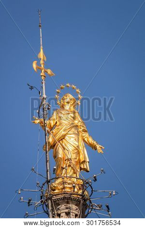 An image of the beautiful golden Madonna statue at Cathedral Milan Italy