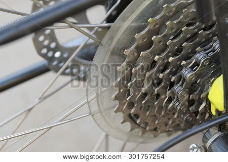 Part Of A Sport Bike With Gray Knitting Needles And Metal Stars