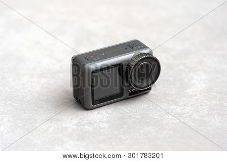 China, Shanghai - May 18, 2019. Closeup View Of Dji Osmo Action And Concrete Background.