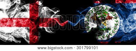 English Vs Belize, Belizean Smoky Mystic Flags Placed Side By Side. Thick Colored Silky Smokes Flag 