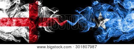 English Vs Somalia, Somalian Smoky Mystic Flags Placed Side By Side. Thick Colored Silky Smokes Flag