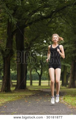Girl Running In The Park