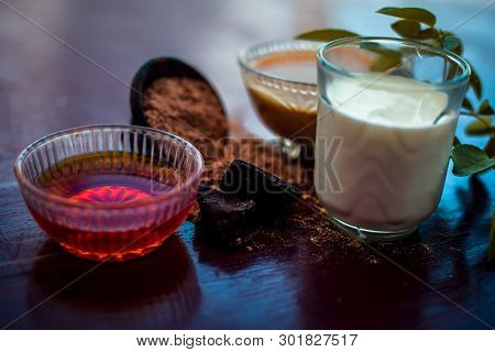 Face Mask Of Devil's Dung Powder On Wooden Surface I.e. Hing Powder Well Mixed With Honey And Milk.u