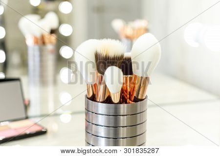Palette With Shadows And Brushes On The Table In The Beauty Salon