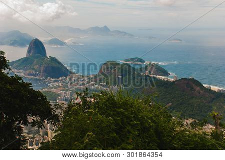 Rio De Janeiro, Sugar Loaf, Brazil: Mountain Resembling Inverted Funnel Behind Urca Hill. Tourist Si