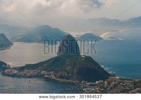 Rio De Janeiro, Sugar Loaf, Brazil: Mountain Resembling Inverted Funnel Behind Urca Hill. Tourist Si