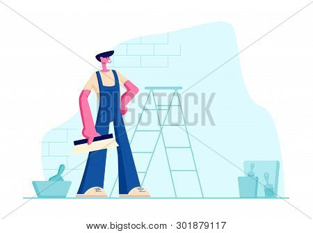 Professional Home Improvement Master In Blue Overalls With Scrapper In Hand. Construction Worker Wit