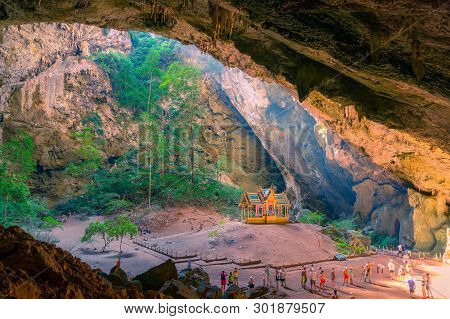 Buddhist Temple In The Cave With Unidentifiable Tourists Around. Khuha Kharuehat Pavilion In Phraya 