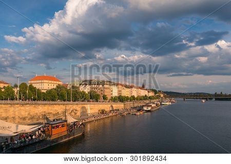 Prague, Czech Republic - May 22, 2018: Prague Waterfront With Restaurants And Tourists And Waterview