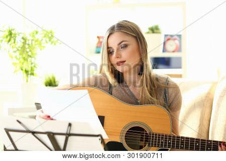 Home Guitar Playing Lesson Girl Hold Instrument. Beautiful Woman At Musical Training. Blonde With Ma