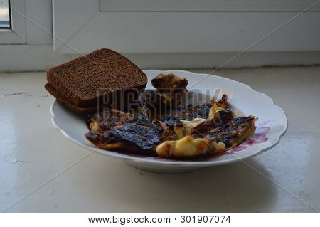 Fried Meat In A Pan With Breading