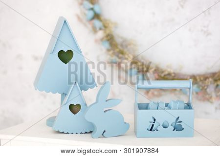 Stylish Home Decor In Blue Is A Wooden Basket, Decorative Nesting Boxes And A Cute Rabbit. Easter De
