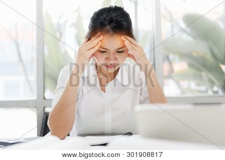 Tired Asian Business Woman With Headache At Office, Visual Migraine, Retinal Migraine, Monocular Mig