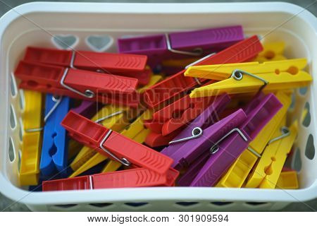 Colorful Plastic Clothespins, Clothes Pegs, Clothespins Collection, Background and Texture of Scattered Clothespins, Lots of Clothespins