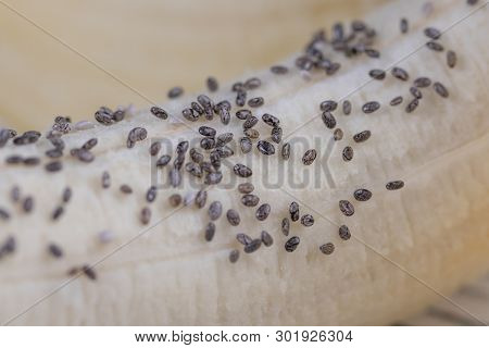 Ripe Banana With Chia Seeds On A Wooden Background