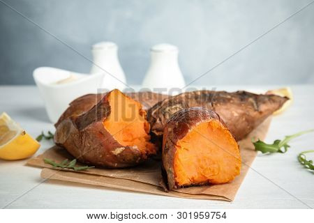 Delicious Baked Sweet Potatoes On White Table