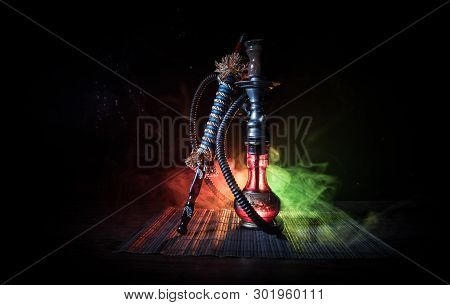 Hookah Hot Coals On Shisha Bowl On Dark Foggy Background. Stylish Oriental Shisha.