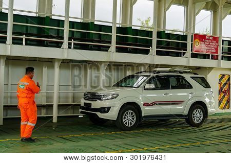 Labuan,malaysia-july 15,2016:worker On Duty At Docking On The Ro-ro Passenger Ship In Labuan,malaysi