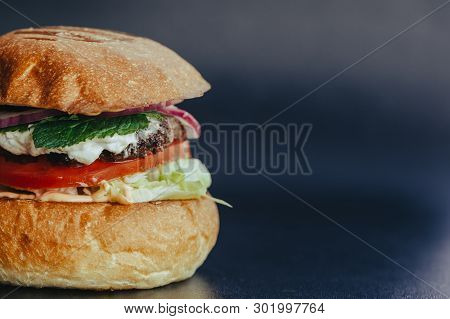 Burger Flyer. Cheese Burger With Grilled Meat, Cheese, Salad And Onion Rings. Close-up Of Delicious 