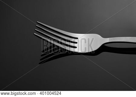 Fork  Lie On A Glass Table In Low Key