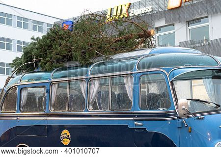 Tallinn. Estonia December 18, 2020 Old Bus, Christmas Tree On The Roof. Bus Station. High Quality Ph
