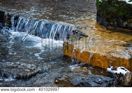 Small Waterfalls On The River, Limestone Layers Painted In Orange With Iron Ochre, Territory Of Glan