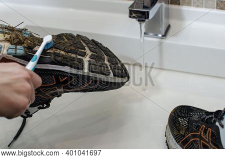 Washing The Dirty Sneakers. Cleaning Running Shoe Outsoles.